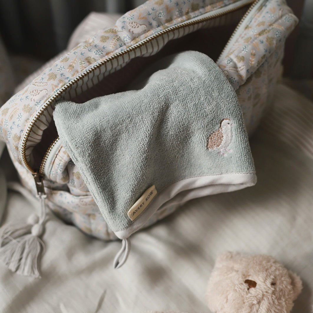 Bath mitt quail inside a wash bag in nature trail print