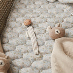 Cute pacifier holder on top of cotton liner nature trail