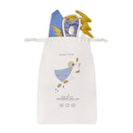 A superhero dress up set inside a drawstring gift bag